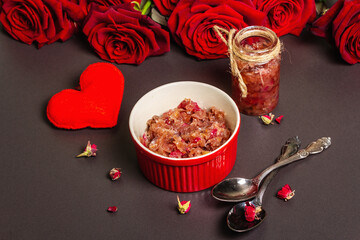 Homemade rose petals jam in bowl and glass jar