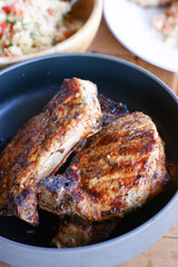 Grilled pork loin with Tabouleh salad and tomato sauce