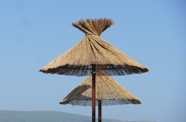 Straw sunshade on the beach