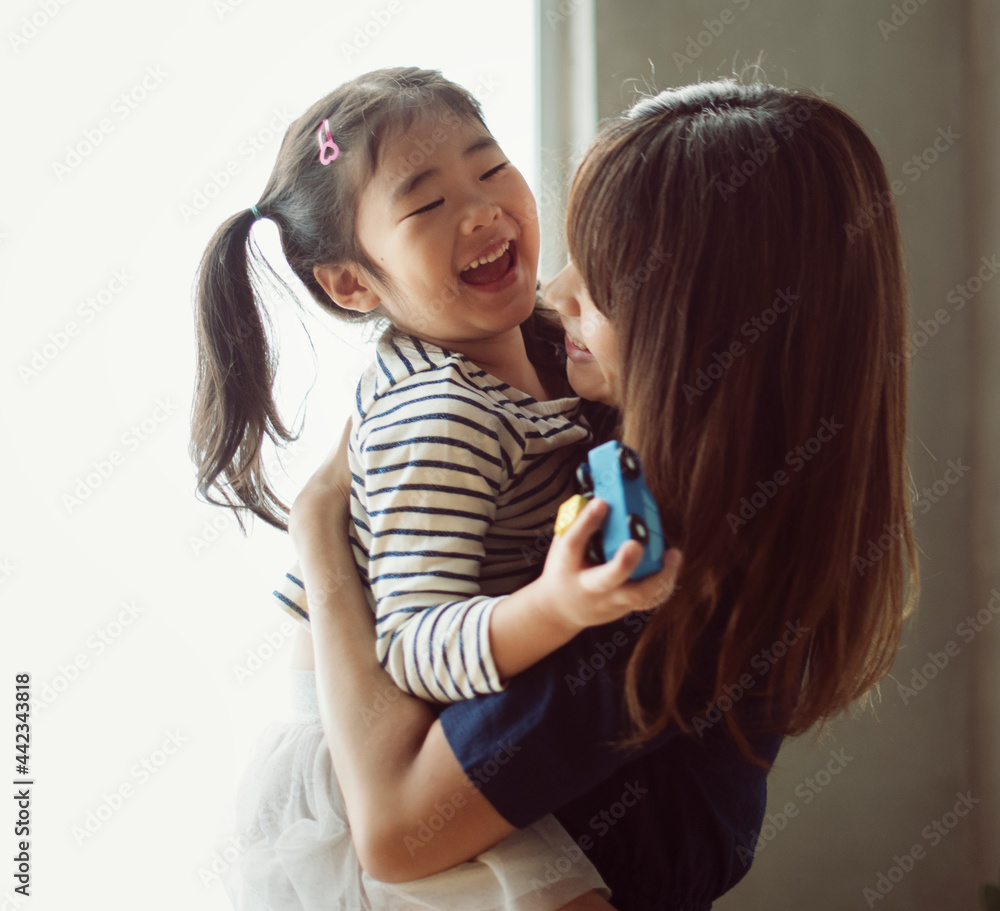 Wall mural Cheerful japanese mother and daughter