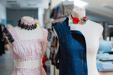studio mannequin dummystylish fashionable trendy clothes on hangers, dressmaking workplace, tailor...