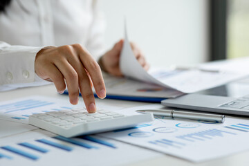 Fototapeta premium Business women working at charts, spreadsheets, graph financial development, bank accounts, statistics, economy, data analysis, investment analysis, stock exchange concept.