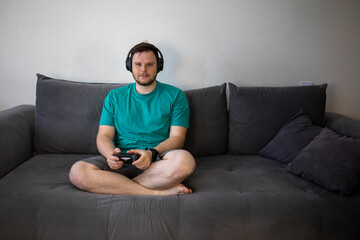 gamer playing video games with controller © phpetrunina14