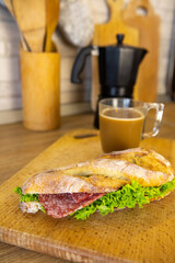 morning breakfast sandwich with coffee mug