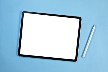 Blank screen tablet with pencil isolated on blue background