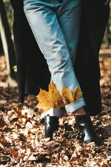 autumn yellow leaves in boots for a girl autumn