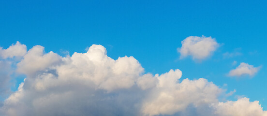 Big white cloud in the blue sky in sunny weather