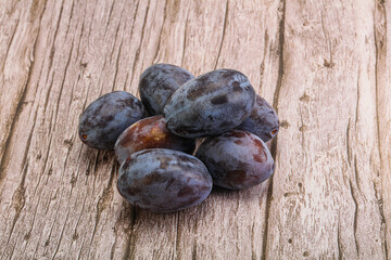 Purple sweet ripe plum heap