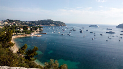 Beautiful panoramic landscape of Villefranche sur mer on a sunny day. A wonderful trip to Cote d'Azur in France. View of the bay near Saint Jean cap Ferrat.