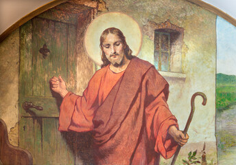 VIENNA, AUSTIRA - JUNI 18, 2021: The symbolic fresco of Jesus knocking on your door in Herz Jesu...