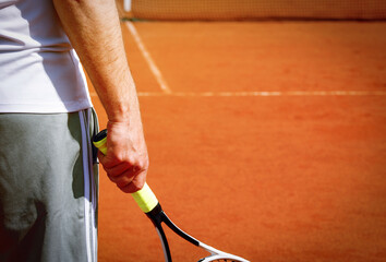 tennis player in action. man playing tennis on clay court. 