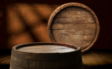 Beer barrel with beer glass on table on wooden background