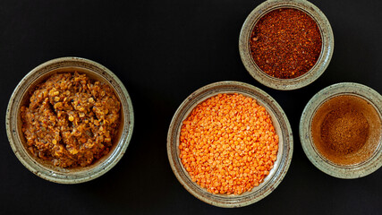 Red lentil ready stew with ingredients: lentils and spice blends: mekelesha and berbere. Ethiopian traditional Misir wat meal.
