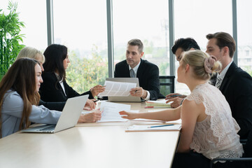group of business people  working and disussing a project together at meeting room
