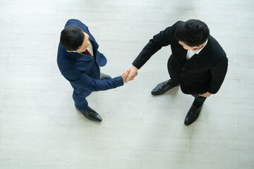 top view of business people shaking hands while workshop training in business event at seminar room. 