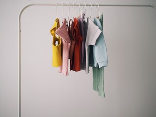 kids' ribbed clothes hang on hangers on the rail
