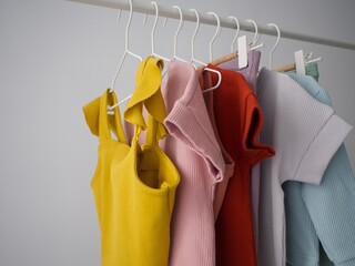 kids' ribbed clothes hang on hangers on the rail