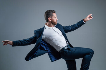Doing your Best. personal achievement goal. man dancing on grey background.
