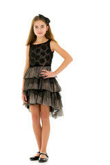 Little girl in an elegant dress.The concept of a happy childhood