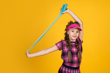 Obraz premium healthy sporty tween girl hold skipping rope, fitness