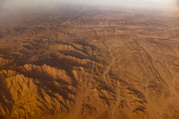 aerial panoramic view over asian desert sand dunes and canyons
