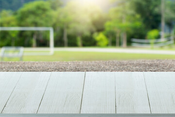 wooden table surface on park background
