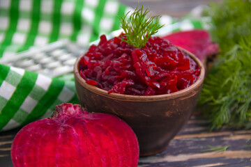 boiled grated beetroot on a wooden background