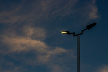 Street lighting under blue sky in the evening.