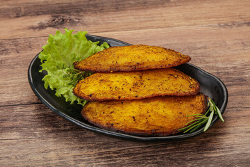 Baked potato with herbs and spices