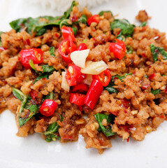 Close up picture of Stir fried beef with basil in white plate