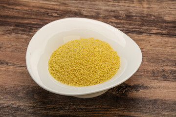 Raw cous cous heap in the bowl