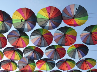 Obraz premium multicolored umbrellas in the blue sky