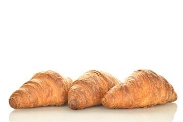 Three fragrant croissants with chocolate filling, close-up, isolated on white.