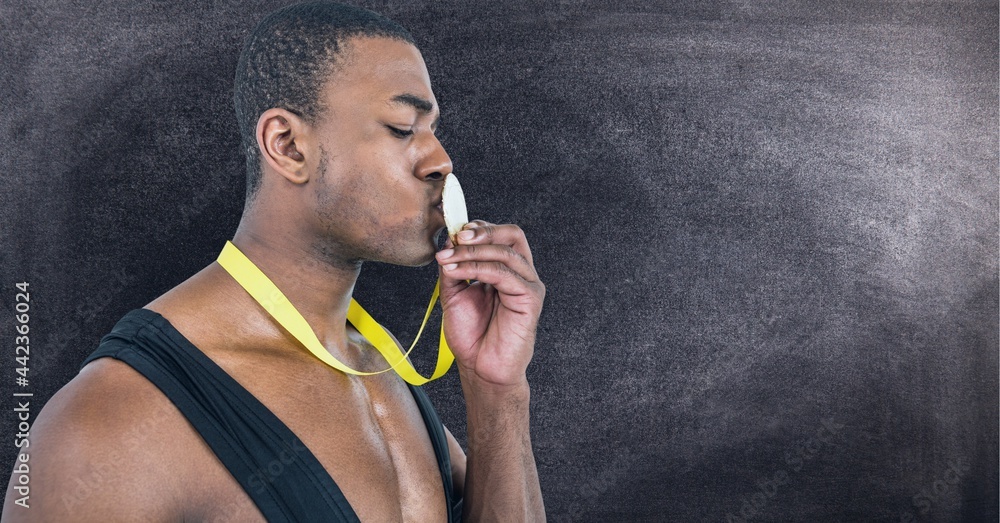 Poster african american man kissing the medal around his neck against texture effect on black background