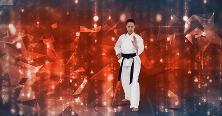 Caucasian female martial artist with black belt against plexus networks on blue background