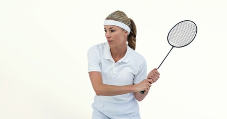 Caucasian female badminton player holding racket against texture white background