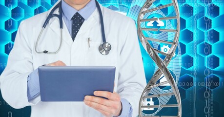 Mid section of male doctor using digital tablet against dna structure and medical data processing
