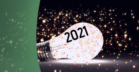 2021 text and golden spots of light over glowing light bulb against green technology background