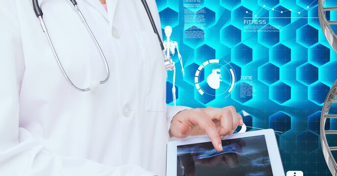 Mid section of doctor using digital tablet against dna structure and medical data processing