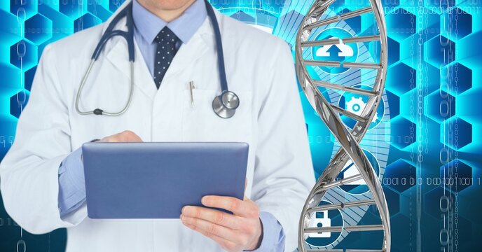 Mid section of male doctor using digital tablet against dna structure and medical data processing