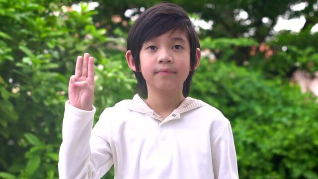 Asian Child Showing Three Fingers
