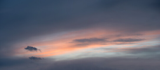 Naklejka na ściany i meble soft grey cloudscape with pastel colored middle. sky background