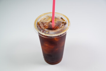 iced black coffee (iced americano) on the wooden table.
