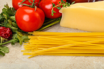 Raw Italian spaghetti heap with cheese