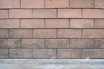 Redbrick wall with cement floor texture for a background.