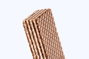 Tasty wafer sticks on white background, flat lay. Sweet food. Square wafer biscuits isolated on white. 