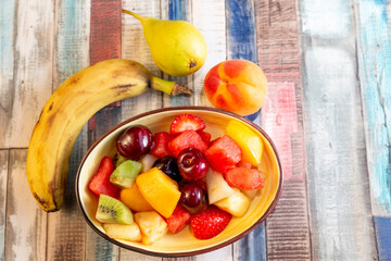 multicolor summer fruit in a bowl
