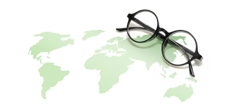 Looking for a Better World Concept, Round shape eyeglasses with light green world map on white background