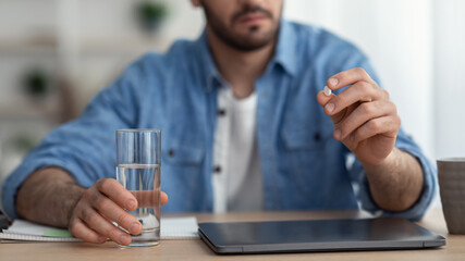 Unrecognizable Sick Man Taking Pills Holding Glass