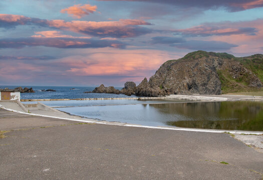 Sunrise Tarlair Swimming Pool, at Devrervon estuary, Macduff, Aberdeenshire, Scotland, UK. Tarlair Pool is in Macduff, a town on the Moray Firth in Aberdeenshire. 